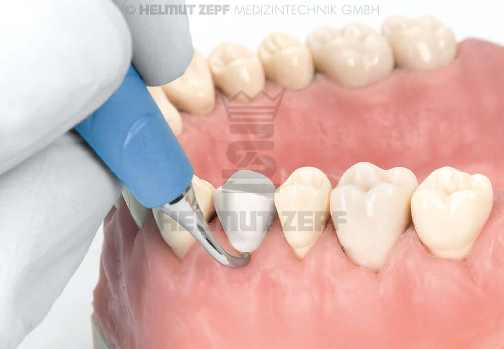 Crown Remover Double-Ended Straight/Curved by Helmut Zepf, bIONIK Turquoise Handle, used on dental model anterior teeth