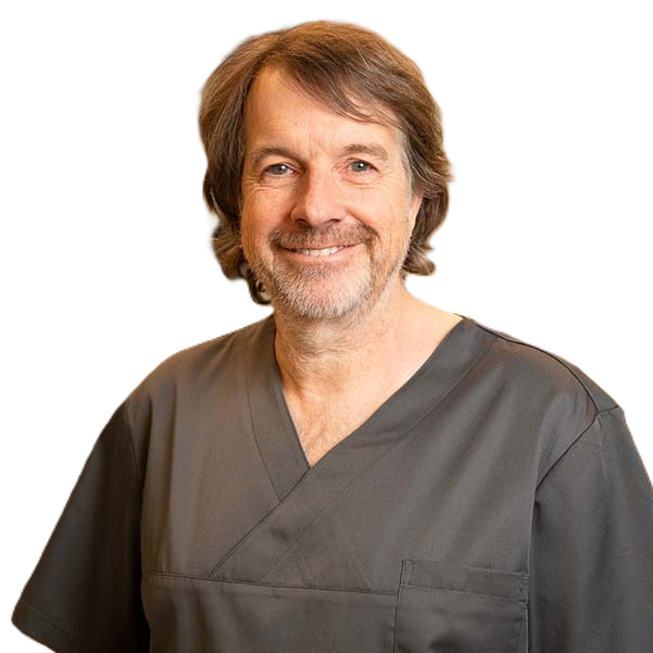 Dr. Claudio Cacaci dentist expert in oral surgery and implantology smiling in his dental practice uniform.