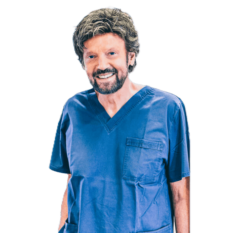 Dr. Bernhard Giesenhagen Instrument collection creator smiling in blue scrubs, implantology expert and innovator
