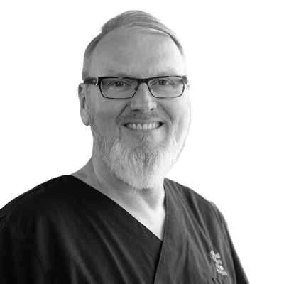 Dr. Detlef Hildebrand Instrument collection creator - implantologist portrait in professional scrubs