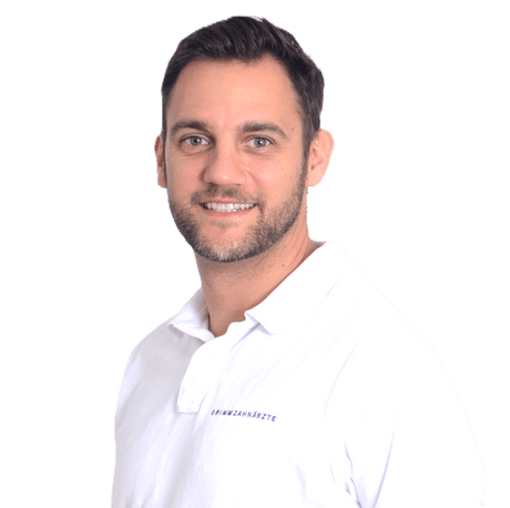 Dr. Marco Zeltner Instrument Collection - Professional Portrait of Dr. Marco Zeltner in White Medical Polo Shirt