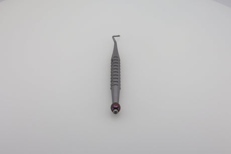 Root tip elevator with angled pick tip and X-Tool handle, designed for precise root retrieval in dental procedures.